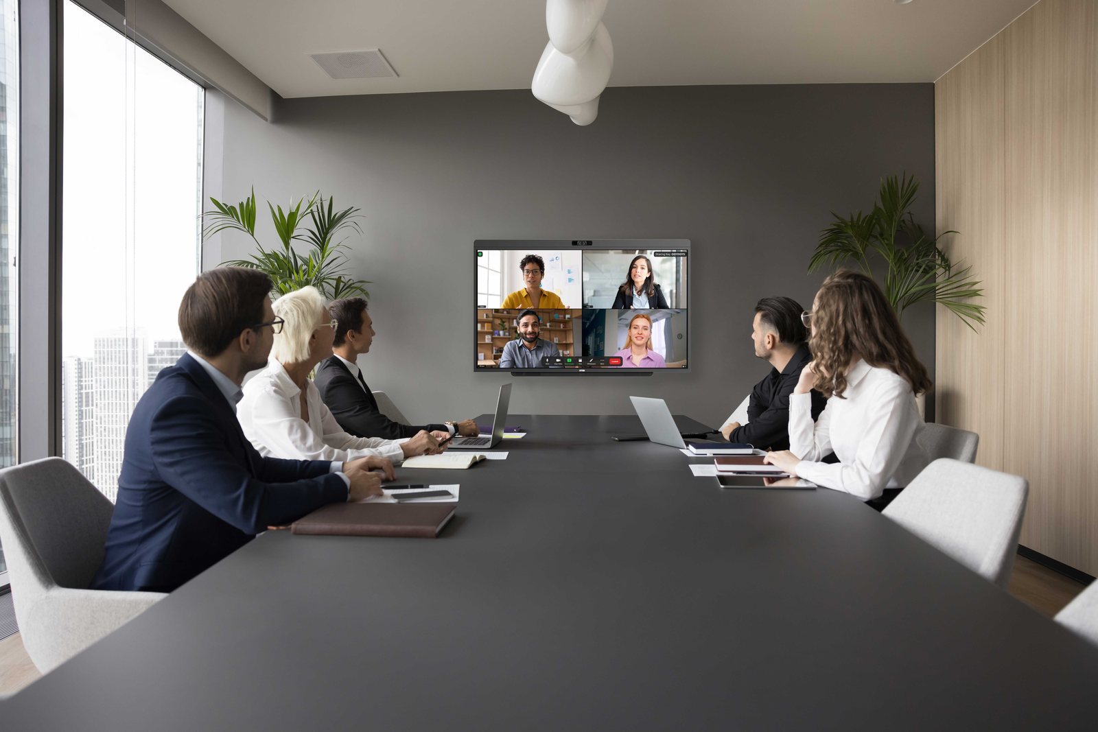Microsoft Teams Room display showing participant gallery in a conference room